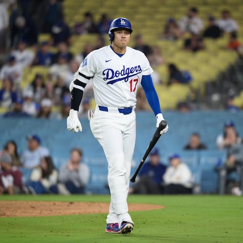 Los Angeles Dodgers' Shohei Ohtani walks back to the dugout after striking out during the ninth inning of a baseball game against the San Francisco Giants in Los Angeles, Monday, May 11, 2026. (AP Photo/Kyusung Gong)