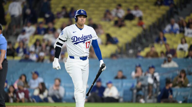 Los Angeles Dodgers' Shohei Ohtani walks back to the dugout after striking out during the ninth inning of a baseball game against the San Francisco Giants in Los Angeles, Monday, May 11, 2026. (AP Photo/Kyusung Gong)