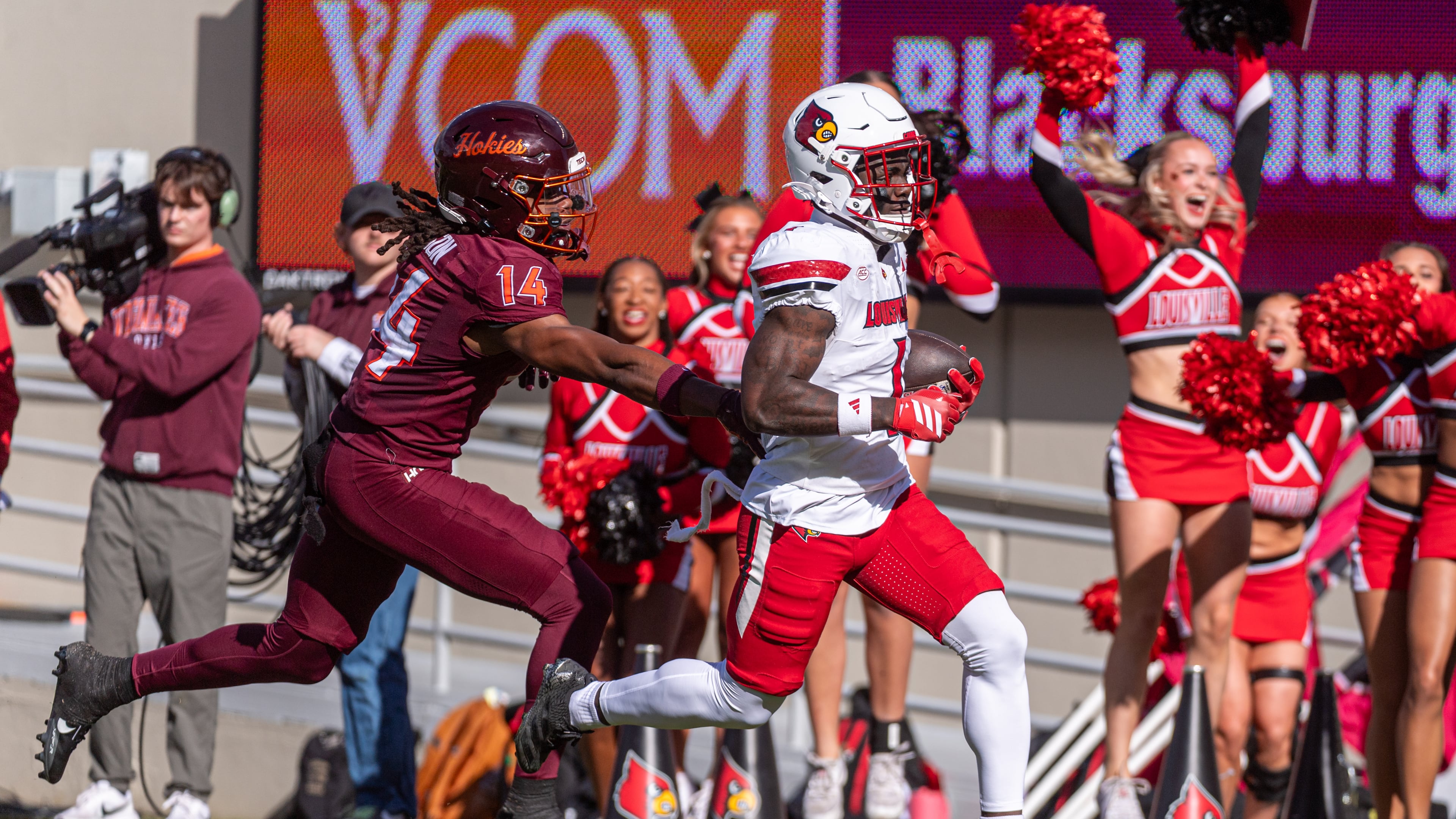 Louisville running back Isaac Brown (1) runs downfield against Virginia Tech during the first half of an NCAA college football game, Saturday, Nov. 1, 2025, in Blacksburg, Va. (AP Photo/Robert Simmons)