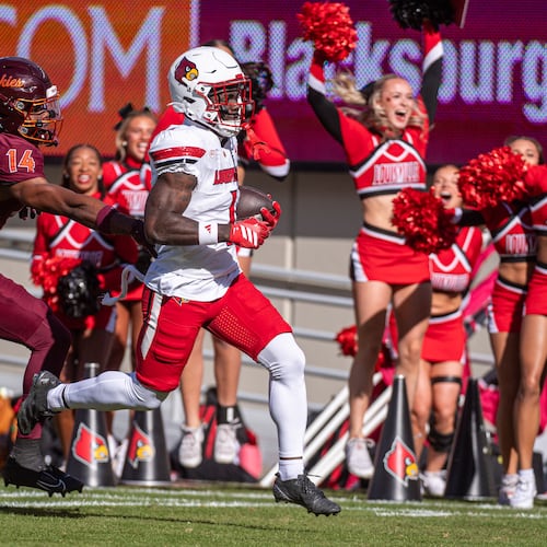 Louisville running back Isaac Brown (1) runs downfield against Virginia Tech during the first half of an NCAA college football game, Saturday, Nov. 1, 2025, in Blacksburg, Va. (AP Photo/Robert Simmons)