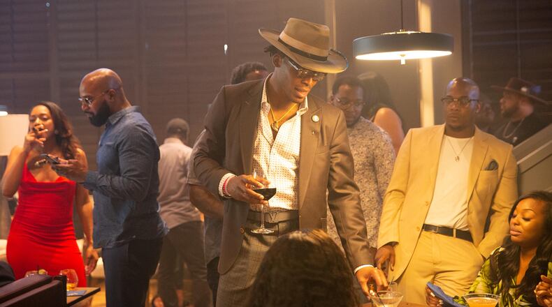 Cam Newton mingles with the guests at the Fellaship official opening. Photo by Marc Fisher/Melt ATL