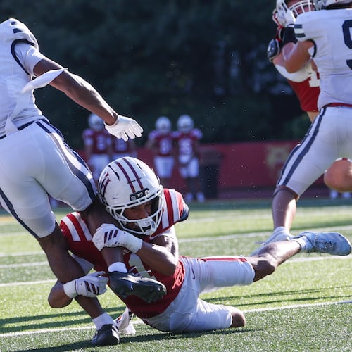 Holy Innocents' cornerback Brayden Bailey, who is the son of UGA great Champ Bailey, tackles Mount Vernon wide receiver Taurean Rawlins (left), who is committed to Georgia, in the second half of the Mount Vernon vs. Holy Innocents' high school football game at Holy Innocents' Episcopal School in Atlanta on Sept. 4, 2026. Holy Innocents' won 51-14. (Arvin Temkar/AJC)