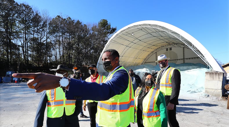 Atlanta Mayor Andre Dickens (from left), Congresswoman Nikema Williams and then-Atlanta Department of Transportation Commissioner Josh Rowan take in a salt barn during a tour of the ATLDOT North Avenue facility on Thursday, Jan. 27, 2022, in Atlanta. Rowan left the department in July. Curtis Compton / Curtis.Compton@ajc.com”