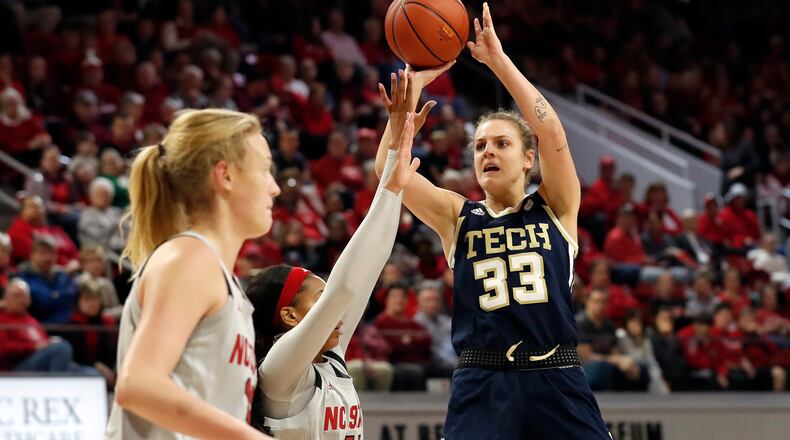 Georgia Tech guard Francesca Pan (33) shoots against North Carolina State guard Jakia Brown-Turner (11) and center Elissa Cunane during the first half Sunday, Feb. 16, 2020,  in Raleigh, N.C.