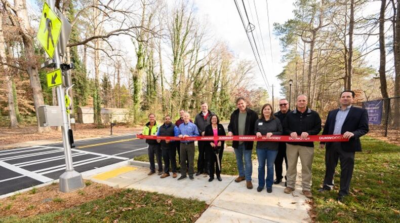 Dunwoody city officials have opened the completed project for the sidewalk, crosswalk and bicycle lane along Peeler Road between Equestrian Way and Cherring Lane. (Atlanta's Event Photographers/Paul Ward Photography)