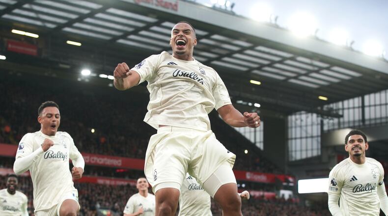 Nottingham Forest's Murillo, centre, celebrates after scoring his side's opening goal during the English Premier League soccer match between Liverpool and Nottingham Forest in Liverpool, England, Saturday, Nov. 22, 2025. (AP Photo/Ian Hodgson)