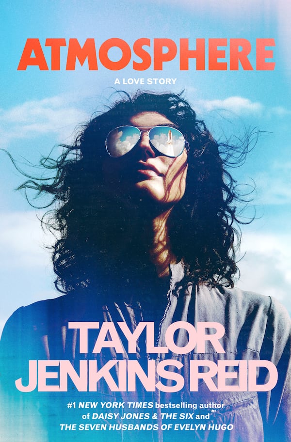 This cover image released by Ballantine shows "Atmosphere" by Taylor Jenkins Reid. (Ballantine via AP)
