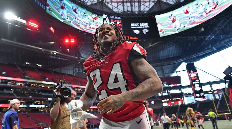 Falcons running back Devonta Freeman leaves with a smile after a win.