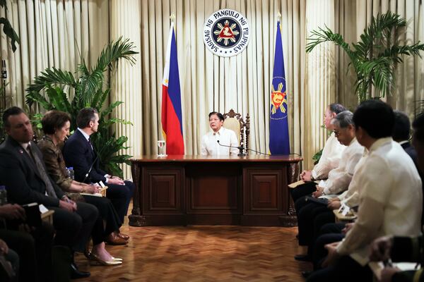 Philippine President Ferdinand Marcos Jr., center, meets with U.S. Defense Secretary Pete Hegseth, third left, at the Malacanang presidential palace in Manila, Philippines, Friday, March 28, 2025. (AP Photo/Basilio Sepe, Pool)