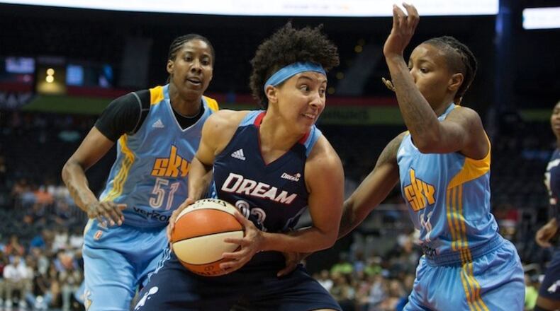 Atlanta Dream guard Layshia Clarendon (23) drives the ball to the basket while being defended by Chicago Sky guard Jamierra Faulkner (21), right, and Chicago Sky forward Jessica Breland (51) during a game between the Atlanta Dream and Chicago Sky at Phillips Arena, Sunday, May 22, 2016, in Atlanta. The Atlanta Dream defeated Chicago Sky 87-81. BRANDEN CAMP/SPECIAL