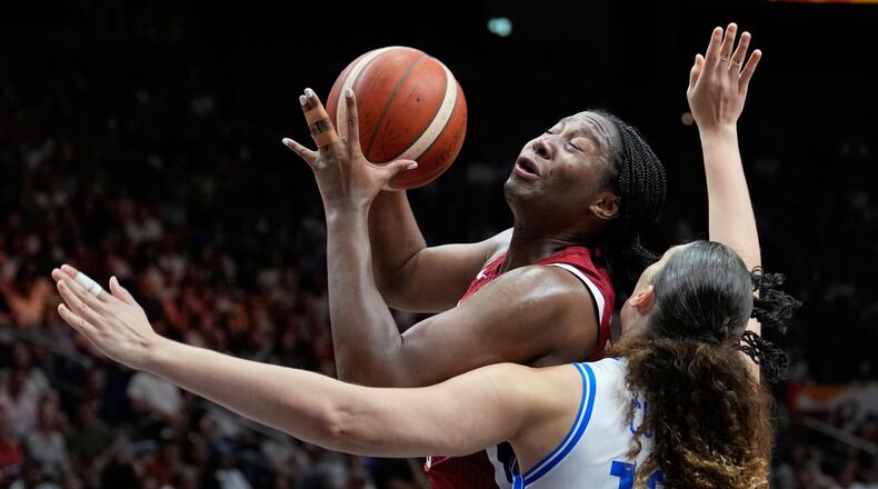 Aliyah Boston, of the United States, shoots over Italy's Lorela Cubaj during the Women's Basketball World Cup match between the United States and Italy in Berlin, Sunday, Sept. 6, 2026. (AP Photo/Ebrahim Noroozi)