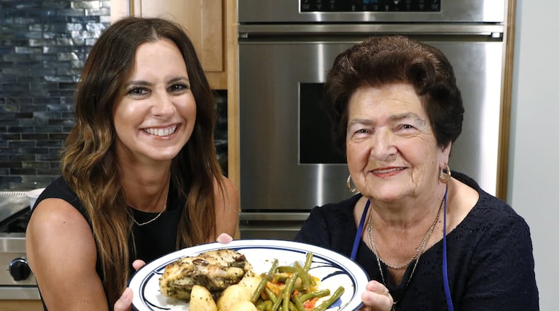 The finished classic Greek lemon chicken and potatoes and Greek green beans prepared by Christina Moros and her grandmother, Christina Zarras in the home of Maria Beys in Dallas on Wednesday, Sept. 13, 2017. (David Woo/The Dallas Morning News/TNS) NO MAGAZINE SALES MANDATORY CREDIT; NO SALES; INTERNET USE BY TNS CONTRIBUTORS ONLY