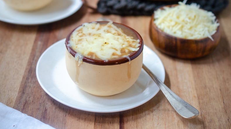 Healthy French Onion Soup capped with melted Gruyere. (Virginia Willis for The Atlanta Journal-Constitution)