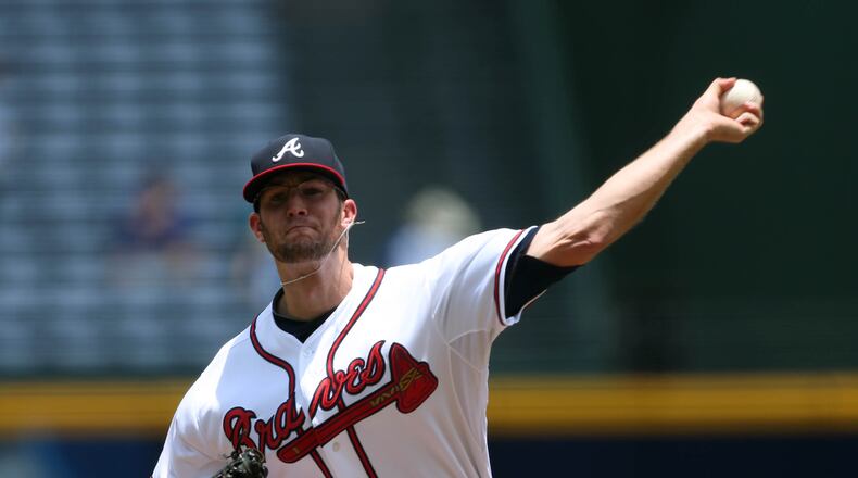 Atlanta Braves pitcher Alex Wood delivers a pitch in the first inning of their game against the New York Mets. JASON GETZ / JGETZ@AJC.COM