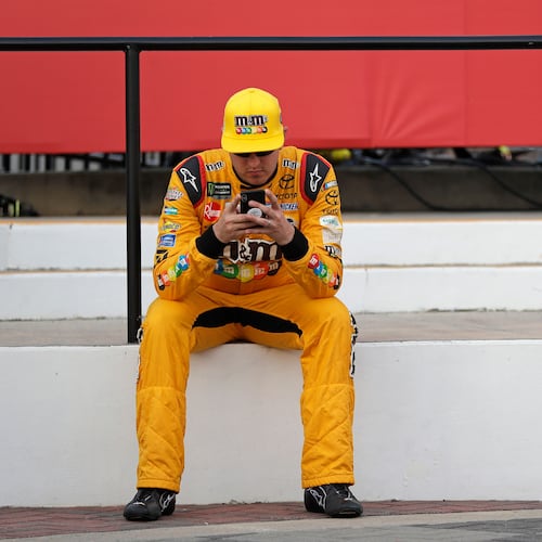 FILE - Kyle Busch waits in Victory Lane after winning the pole position for the NASCAR Cup series auto race at Charlotte Motor Speedway in Charlotte, N.C., Thursday, May 24, 2018. (AP Photo/Chuck Burton, File)