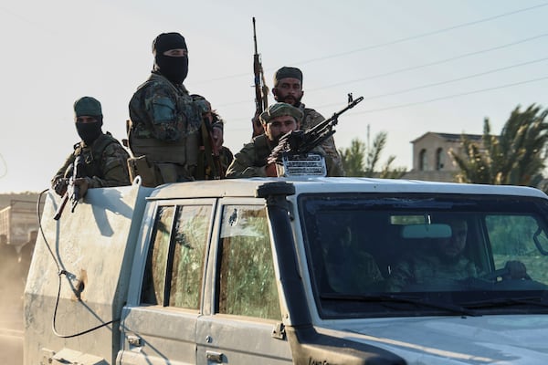Syrian government forces deploy at the Mazraa village on the outskirts of city of Sweida, where clashes erupted between Sunni Bedouin clans and Druze militias, southern Syria, Monday, July 14, 2025. (AP Photo/Ghaith Alsayed)