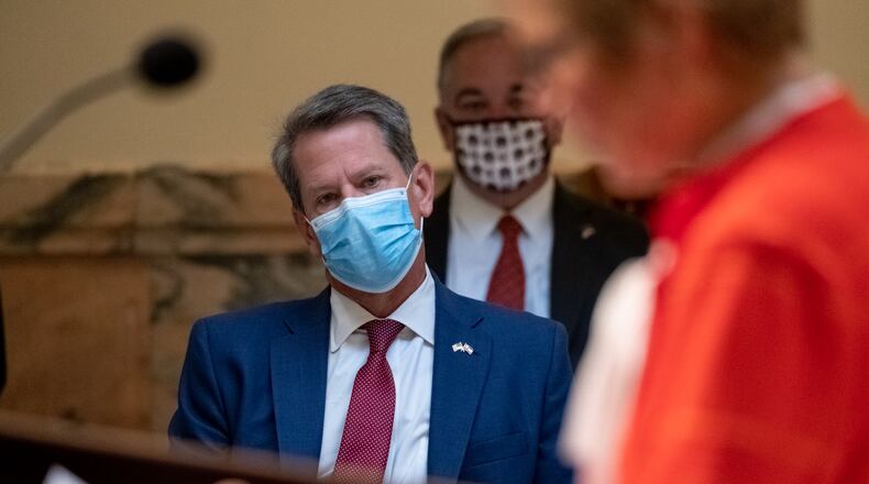 200717-Atlanta-Gov. Brian Kemp listens to Dr. Kathleen Toomey, commissioner of the Georgia Department of Public Health, during a coronavirus briefing Friday morning July 17, 2020 at the State Capitol. Ben Gray for the Atlanta Journal-Constitution