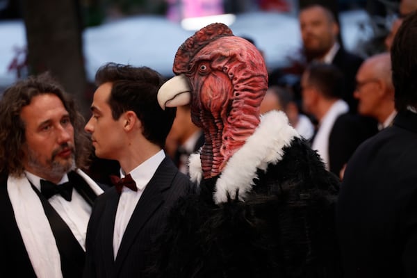 A person dressed in a bird costume poses for photographers upon arrival at the premiere of the film 'Die, My Love' at the 78th international film festival, Cannes, southern France, Saturday, May 17, 2025. (Photo by Joel C Ryan/Invision/AP)