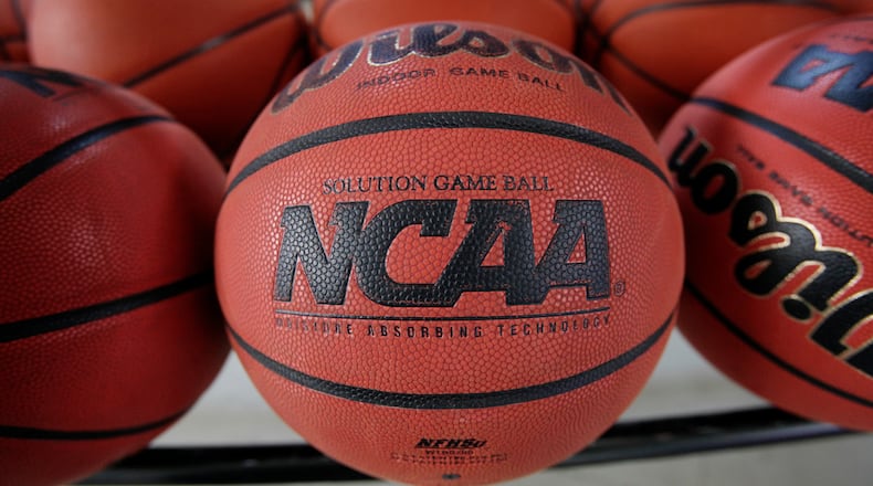 FILE - In this March 22, 2010, file photo, basketballs sit in a rack before an college basketball practice in Cedar Falls, Iowa. (AP Photo/Charlie Neibergall, File)