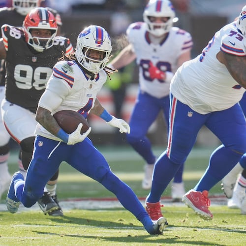 Running back James Cook (center) rushed for 117 yards and two touchdowns on 16 carries to help lift Buffalo to a 23-20 road win over the Browns on Sunday, Dec. 21, 2025, in Cleveland. (Sue Ogrocki/AP)