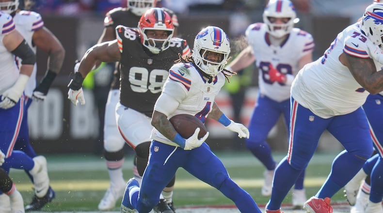 Running back James Cook (center) rushed for 117 yards and two touchdowns on 16 carries to help lift Buffalo to a 23-20 road win over the Browns on Sunday, Dec. 21, 2025, in Cleveland. (Sue Ogrocki/AP)