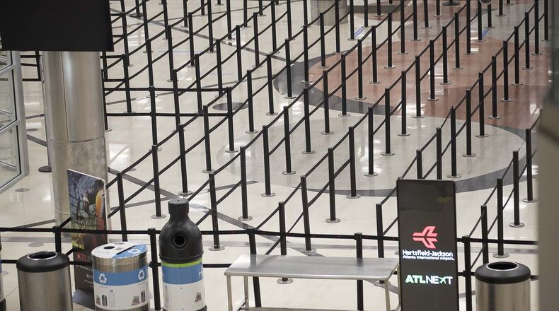 There are no lines at the main security checkpoint inside the domestic terminal at Hartsfield-Jackson International Airport in Atlanta, Tuesday, April 14, 2020. (ALYSSA POINTER / ALYSSA.POINTER@AJC.COM)