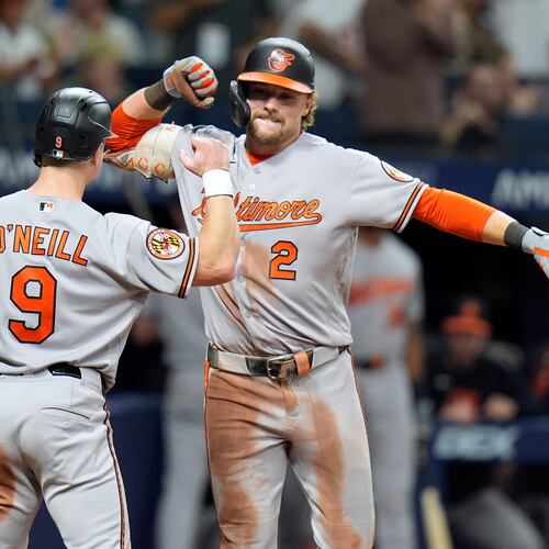 Baltimore Orioles' Gunnar Henderson (2) celebrates his two-run home run off Tampa Bay Rays pitcher Chris Roycroft with Tyler O'Neill (9) during the eighth inning of a baseball game Friday, Aug. 14, 2026, in St. Petersburg, Fla. (AP Photo/Chris O'Meara)