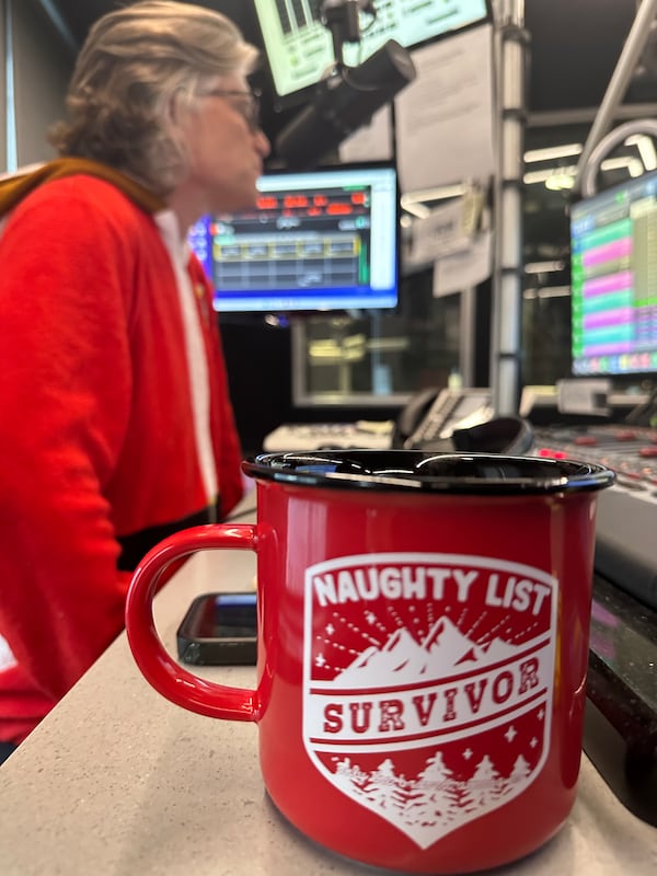 Kevin Avery not only wore a Buc-cee's onesie to introduce all Christmas music to Star 94 but brought this mug for the occasion on Nov. 26, 2025, at Star studios in Colony Square. (Rodney Ho/AJC)