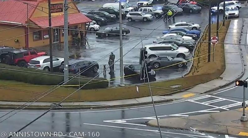 Gwinnett County police officers gathered outside the Royal Court Motors car dealership for a homicide investigation Friday afternoon.