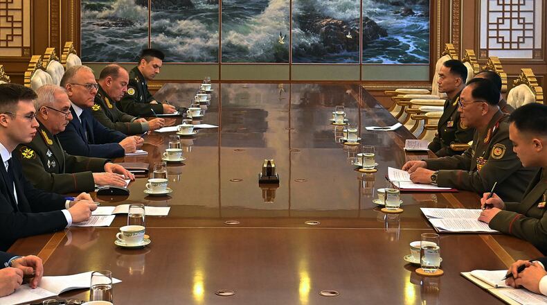 In this photo provided by North Korean government, Russian Vice Defense Minister Viktor Goremykin, second left, meets North Korean Defense Minister No Kwang Chol, second right, at an undisclosed place in North Korea Thursday, Nov. 6, 2025. Independent journalists were not given access to cover the event depicted in this image distributed by the North Korean government. The content of this image is as provided and cannot be independently verified. (Korean Central News Agency/Korea News Service via AP)