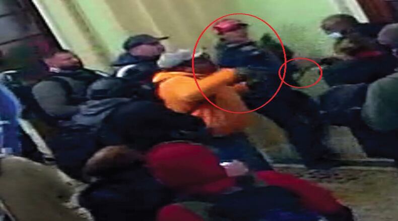 The FBI's criminal complaint against 18-year-old Bruno Cua includes this U.S. Capitol surveillance video, in which the FBI says Cua is shown in a physical altercation with U.S. Capitol Police outside the Senate chamber doors.