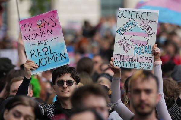 Campaigners take part in a rally organised by trans rights groups, trade unions, and community organisations following the Supreme Court ruling on the definition of a woman in equalities law, at Parliament Square, central London, Saturday April 19, 2025. (AP Photo/Alastair Grant)