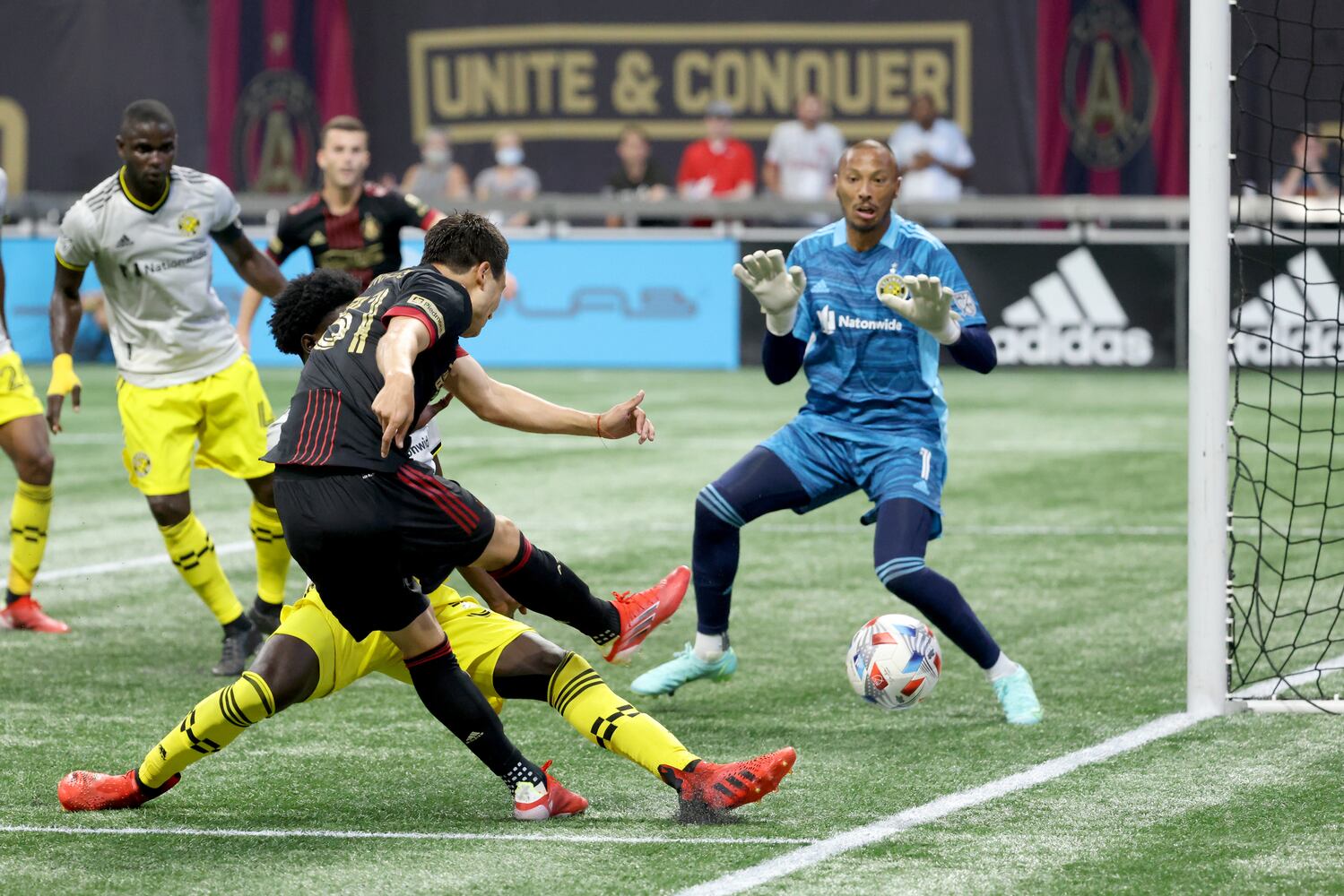 Atlanta United forward Erick Torres (31) attempts a shot against Columbus Crew goalkeeper Eloy Room (1). JASON GETZ FOR THE ATLANTA JOURNAL-CONSTITUTION