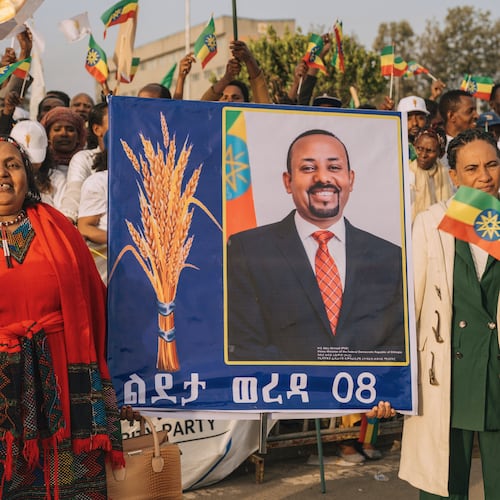 Supporters of Ethiopia's ruling party hold a large portrait of Prime Minister Abiy Ahmed at a rally ahead of the national elections in Addis Ababa, Ethiopia, Tuesday, May 26, 2026. (AP Photo/Amanuel Sileshi)