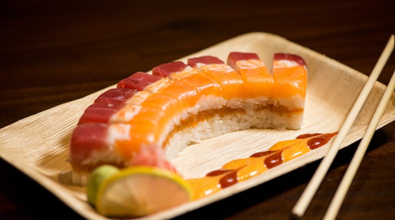 Miso Ko Oshi Sushi roll, layered sushi with rice, tempura, masago, and mayo topped with tuna, sake, and shrimp, aioli. Photo credit- Mia Yakel.