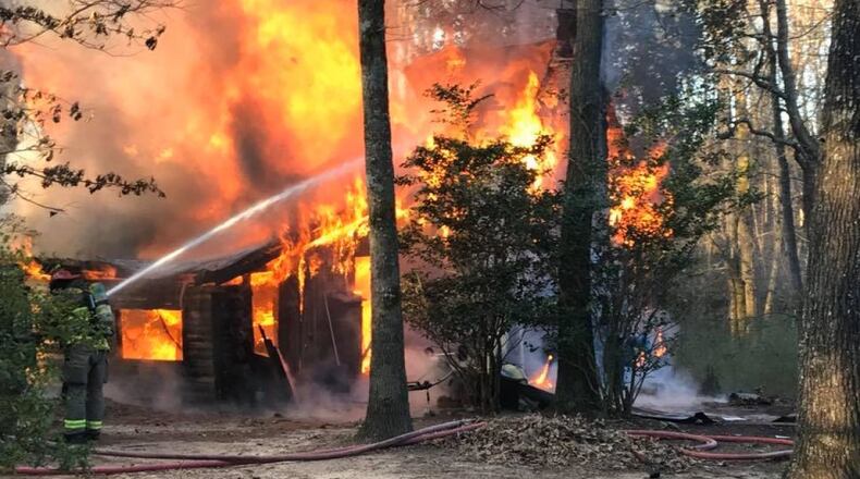 Photos of the blaze shared by the sheriff's office showed the log cabin completely engulfed in flames.