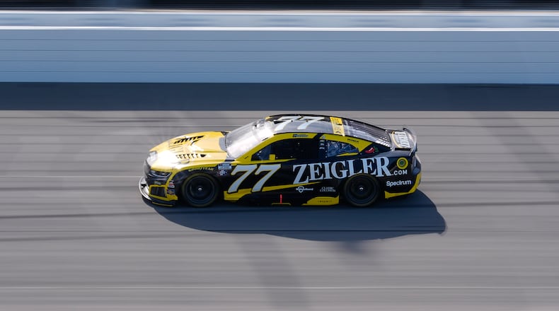 Carson Hocevar (77) drives during a NASCAR Cup Series auto race at Michigan International Speedway in Brooklyn, Mich., Sunday, June 7, 2026. (AP Photo/Paul Sancya)