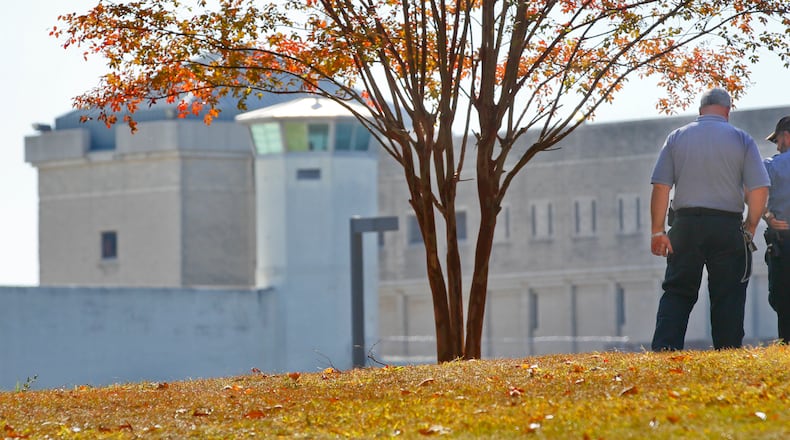 Prison officials survey a portion of the Atlanta Federal Penitentiary. (AJC file, 2011, John Spink)
