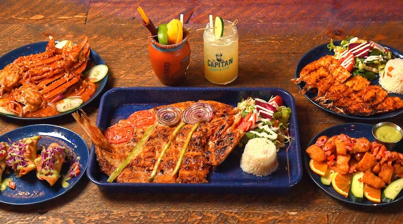 El Capitan's menu includes Patas De Cangrejo (crab legs; upper left), Pescadilla (quesadillas filled with fish stew; lower left), Canta Rito (drink at top-left), Capitan Margarita (drink at top-right), Pescado Zarandeado (red snapper; center below drinks), Zarandeados (marinated shrimp; upper right) and Chicharron De Pescado (marinated, then fried fish; lower right). (Chris Hunt for The Atlanta Journal-Constitution)
