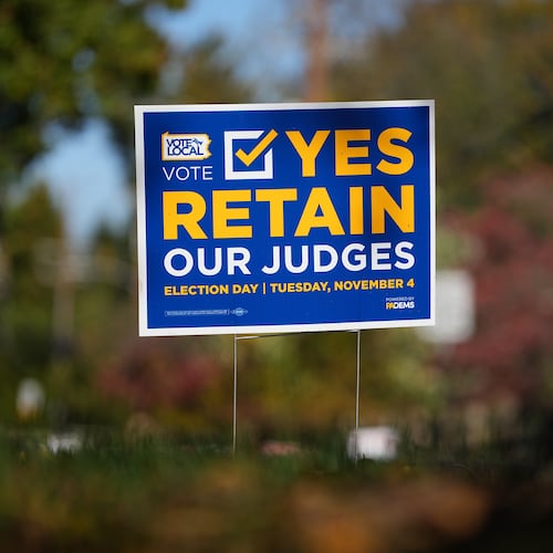 A sign is posted in support of retaining Pennsylvania Supreme Court justices in the November election, in Berwyn, Pa., Wednesday, Oct. 22, 2025. (AP Photo/Matt Rourke)