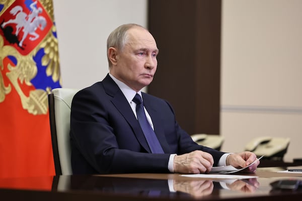 Russian President Vladimir Putin listens to Russian Chief of General Staff Gen. Valery Gerasimov with the report that all Ukrainian troops have been forced from Russia's Kursk region, during their meeting via videoconference in Moscow, Russia, Saturday, April 26, 2025. (Alexander Kazakov, Sputnik, Kremlin Pool Photo via AP)
