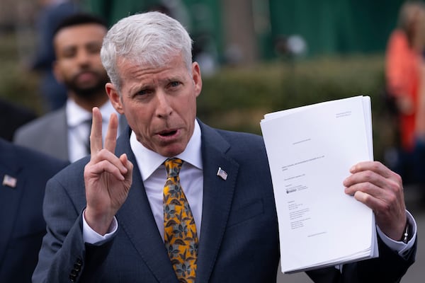 Energy Secretary Chris Wright holds a report concerning U.S. exports of liquefied natural gas (LNG) as he speaks to reporters at the White House in Washington, Wednesday, March 19, 2025. (Ben Curtis/AP)