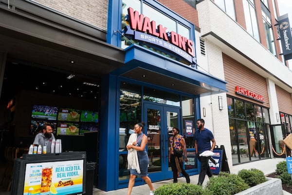 People walk by Walk-On’s Sports Bistreaux on Battery Avenue in Atlanta on Friday, July 11, 2025. Walk-On’s Sports Bistreaux signed a lease in January and worked fast to launch last month, anticipating the MLB All-Star weekend. (Abbey Cutrer/AJC)