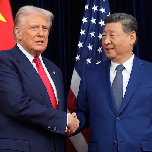FILE - President Donald Trump, left, and Chinese President Xi Jinping shake hands before their meeting at Gimhae International Airport in Busan, South Korea, Oct. 30, 2025. (AP Photo/Mark Schiefelbein, File)