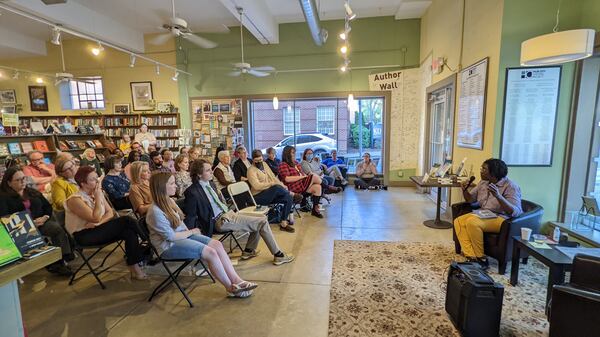 Marlanda Dekine reads at the book launch for their poetry collection "Thresh & Hold" at the Hub City Bookshop in Spartanburg, South Carolina. (Courtesy of Hub City Press/ Meg Reid)