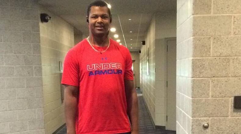 Mauricio Cabrera on the self-balancing scooter unicycle he rides to the ballpark from his nearby hotel at the Arizona Fall League. (Photo by David O'Brien)