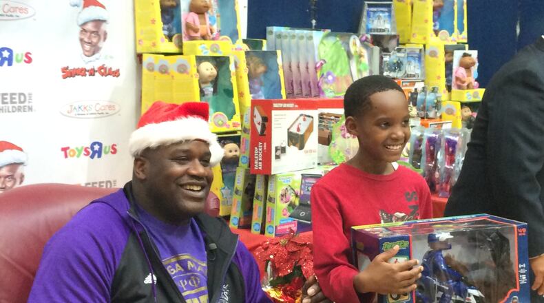 Shaquille O'Neal greets children at a Boys & Girls Club event in 2014. Photo credit: Jennifer Brett