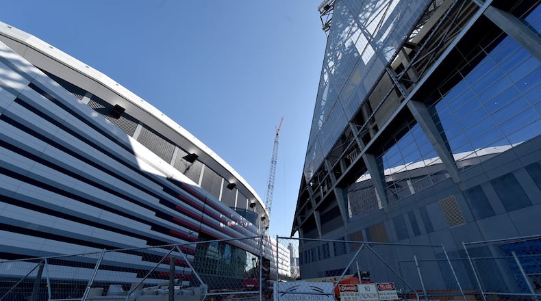 Mercedes-Benz Stadium is under construction next door to the Georgia Dome. (AJC photo by Brant Sanderlin)