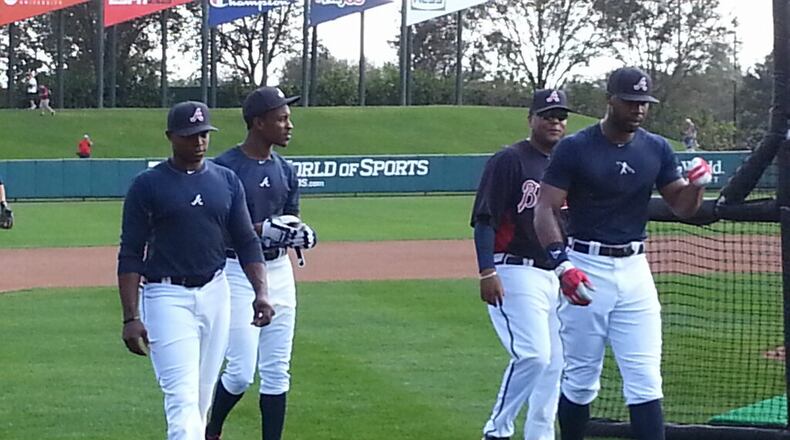 The Braves' revamped outfield worked out for the first time together Tuesday, with newcomer brothers Justin Upton (left) and B.J. Upton joining incumbent right fielder Jason Heyward. Triple-A hitting coach Jamie Dismuke is behind Heyward. (Photo by David O'Brien)