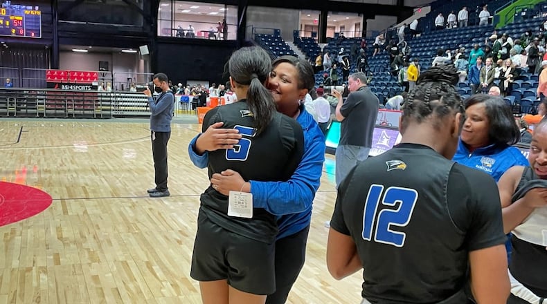 Mount Paran's Kara Dunn (5) celebrates with her mother and coach, Stephanie Dunn, after the Eagles' 54-49 victory over Hebron Christian is the Class A Private girls basketball championship game on March 12, 2022, at the Macon Coliseum.